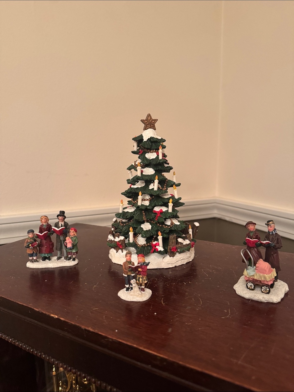 St. Nicholas Square Caroling Around the Tree with Candle and Red Bow Accents 4pc